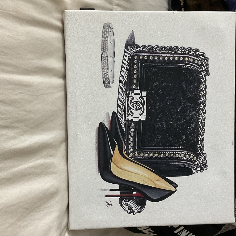 Pretty canvas Wall art 
Redbottom heels
Chanel bag 
Cartier Bracelet